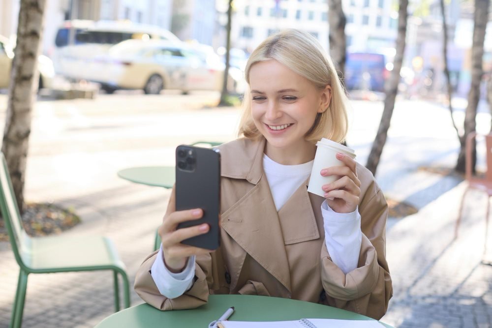 Online dating chat over coffee outdoors
